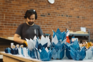 Artisan Nick hard at work hand forming votives.