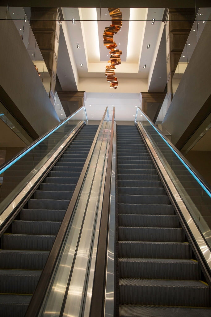 The installation hangs above the escalators, creating an impressive entrance to the restaurant.