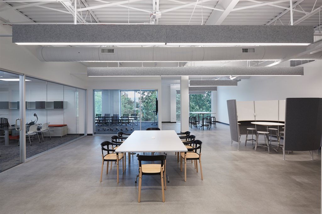 A great example of incorporating a semiprivate space for teams to gather, in addition to the open collaborative environment.